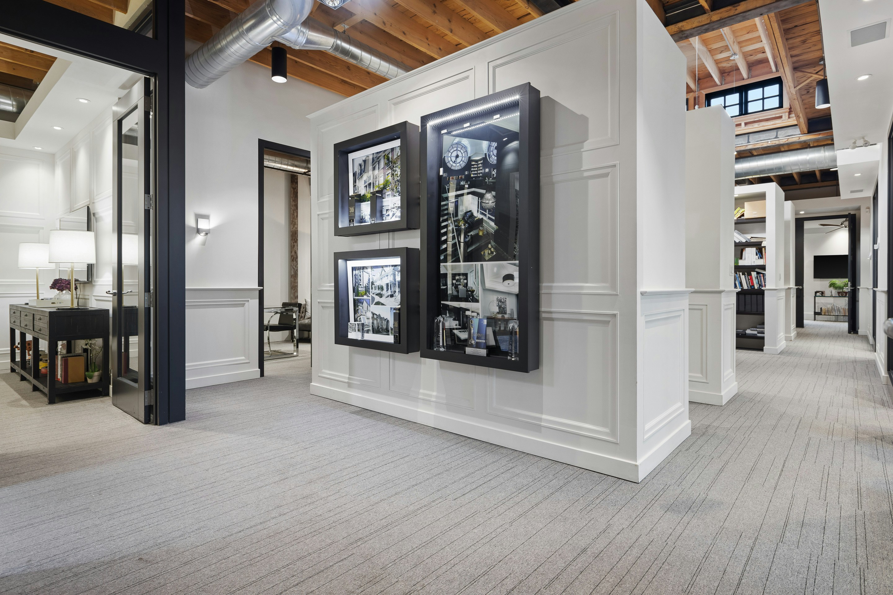 Framed art on a wall in a contemporary office space